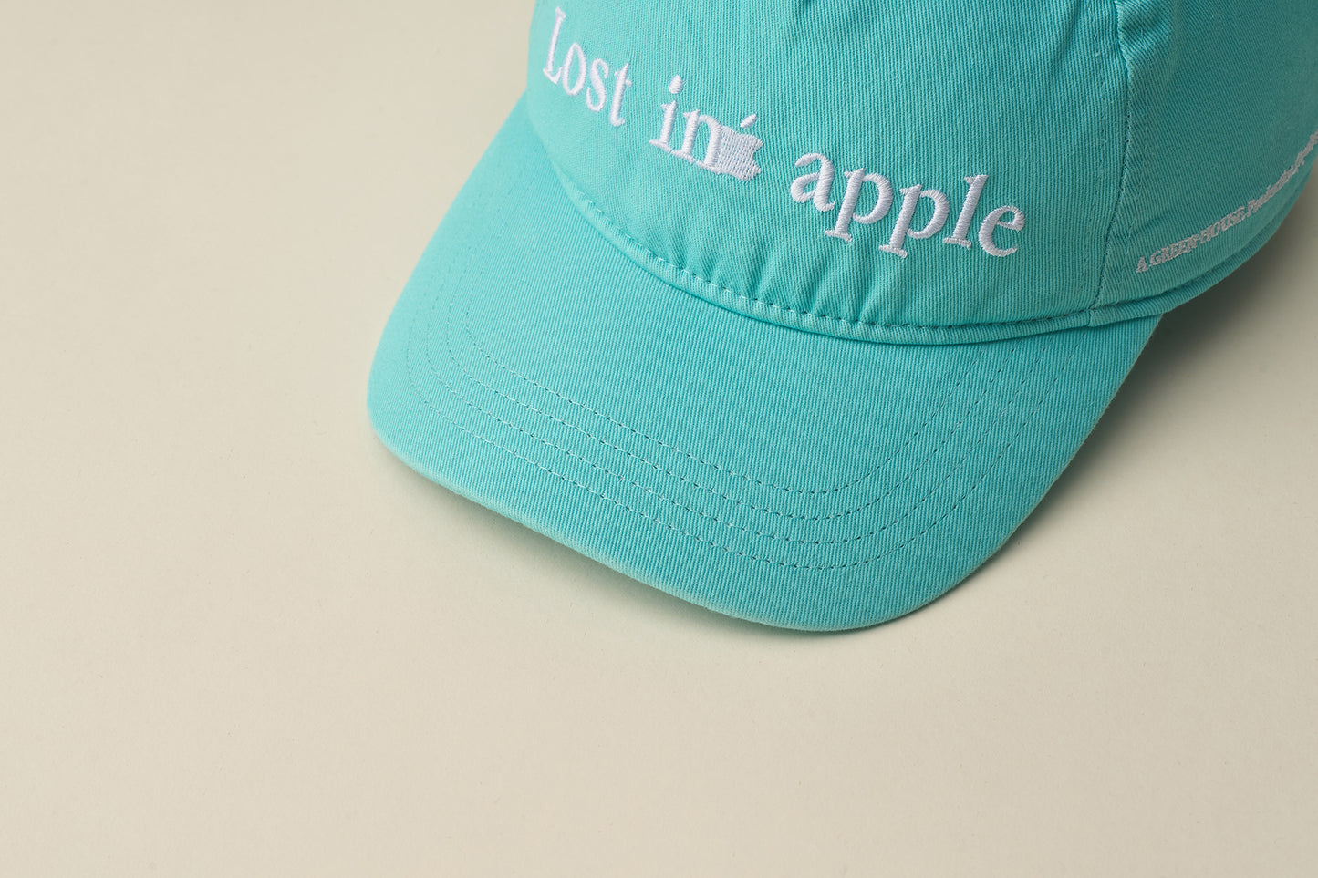 LOST IN APPLE Series 2025 – Relaxed BASKETBALL CAP TIFFANY
